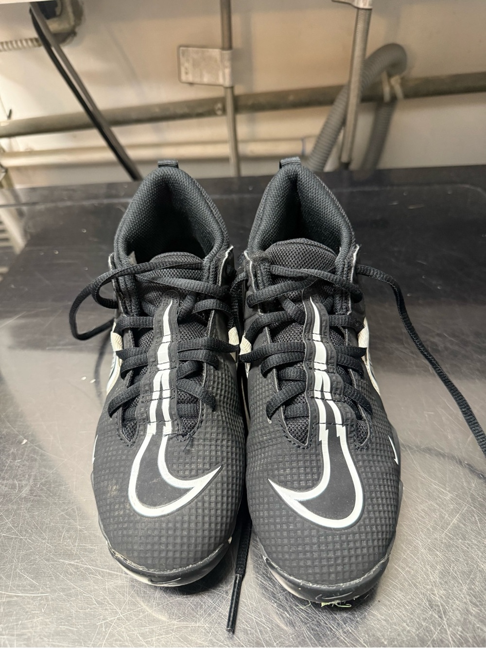 Nike Black and White boys football Cleats.